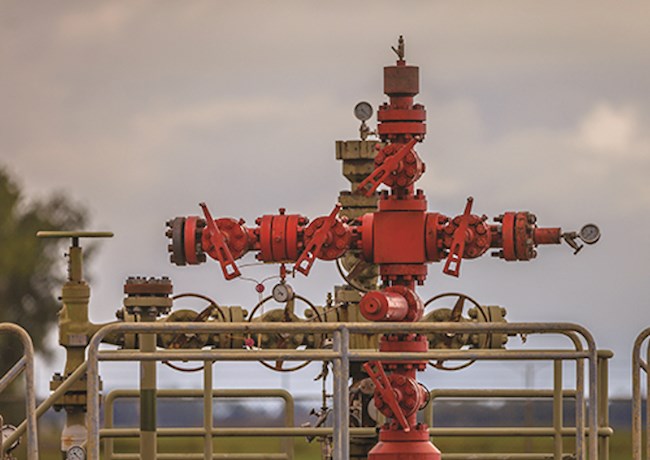 Red well head at gas field station