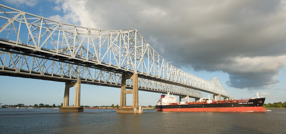 a ship passes under a bridge a ship passes under a bridge