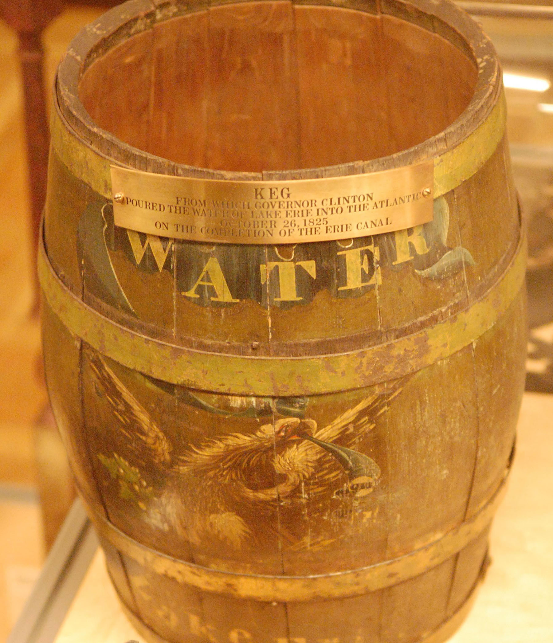 an old-time barrel with the word water written on it an old-time barrel with the word water written on it