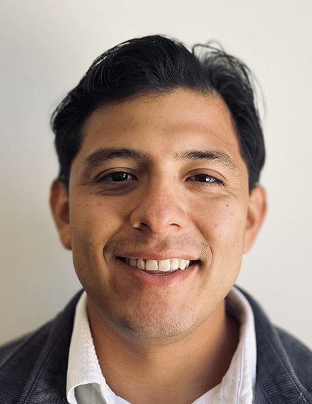 man smiles for the camera