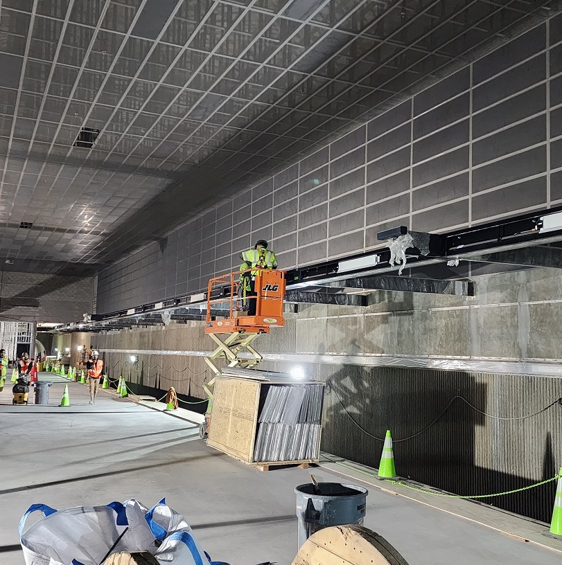 workers in an under-construction subway station