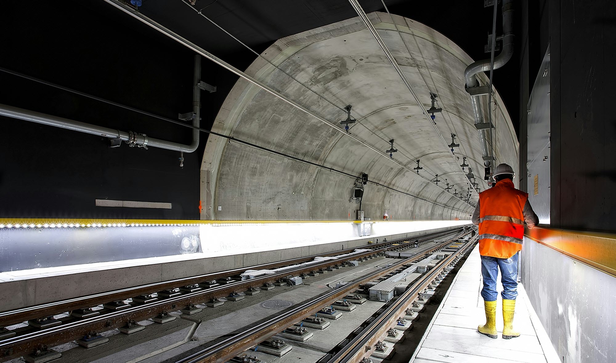 Photo of a civil engineer standing in a subway tunnel
