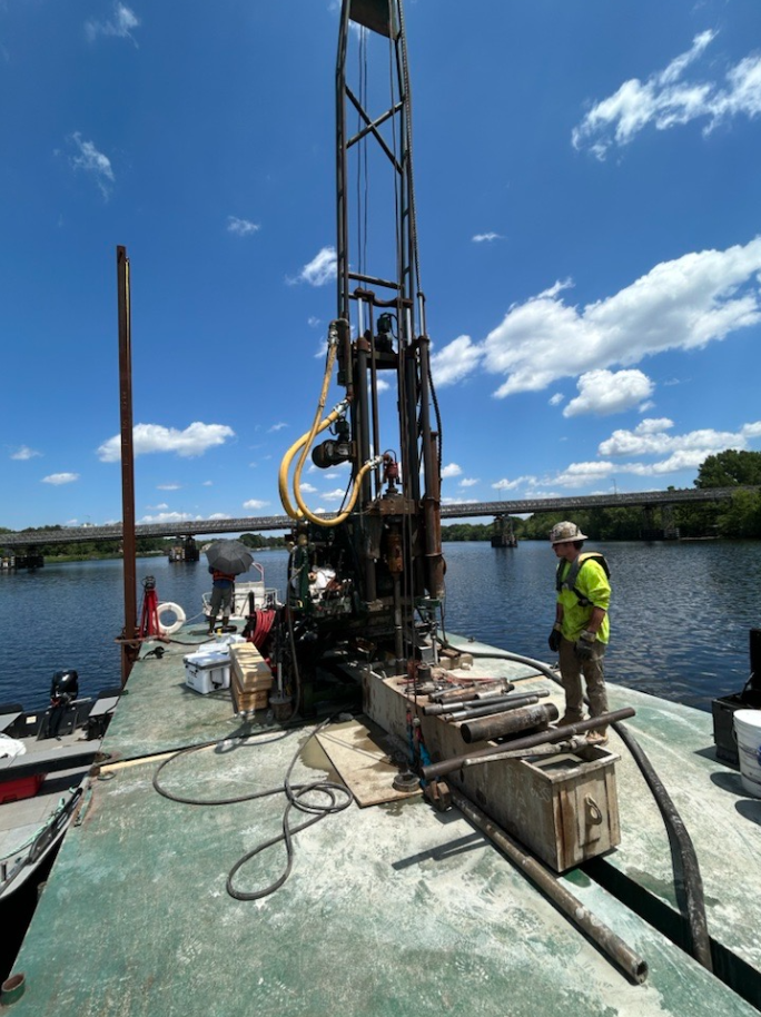 people conduct site work for a new bridge