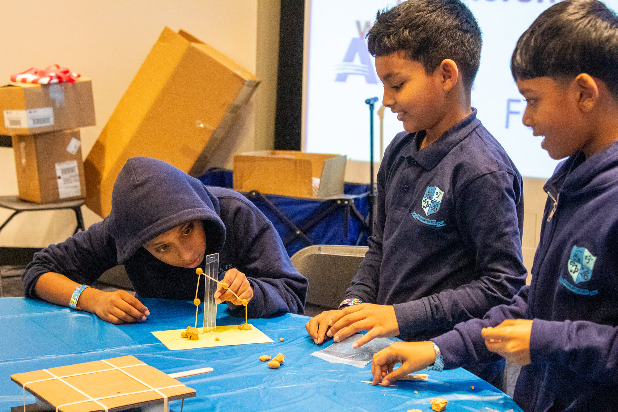 photos of children doing an outreach activity