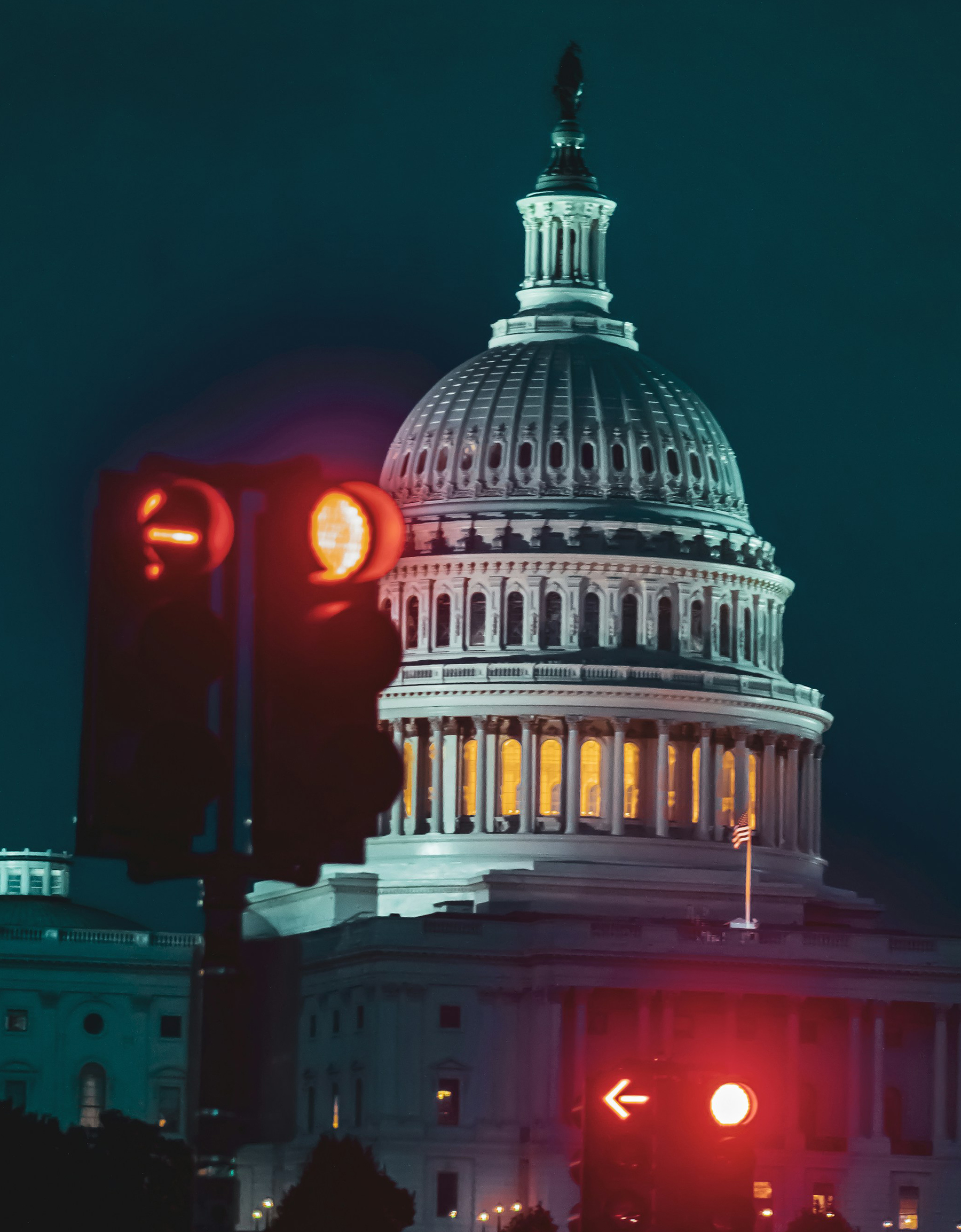 image of the Capitol building with traffic signals in the red position in the foreground