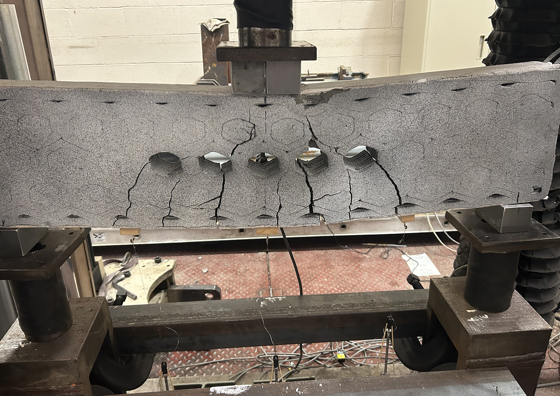 a 3D-printed concrete beam undergoes stress testing