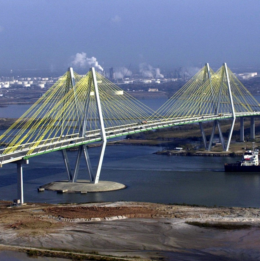 a cable-stayed bridge stretches across water