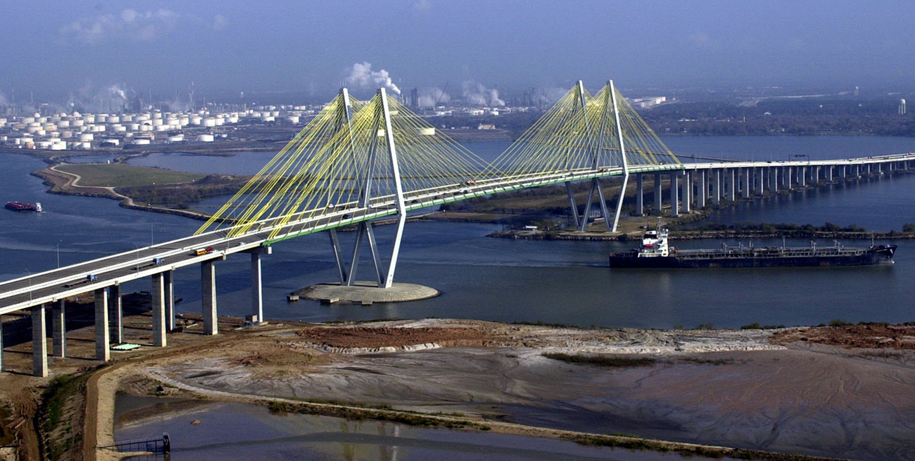a cable-stayed bridge stretches across a body of water