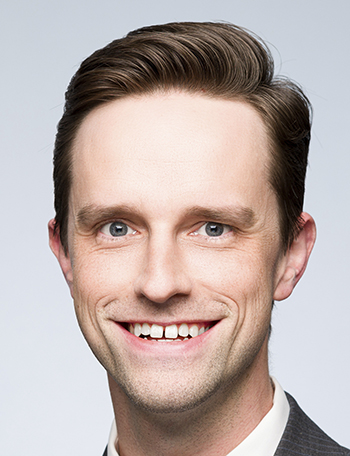 a man smiles for the camera