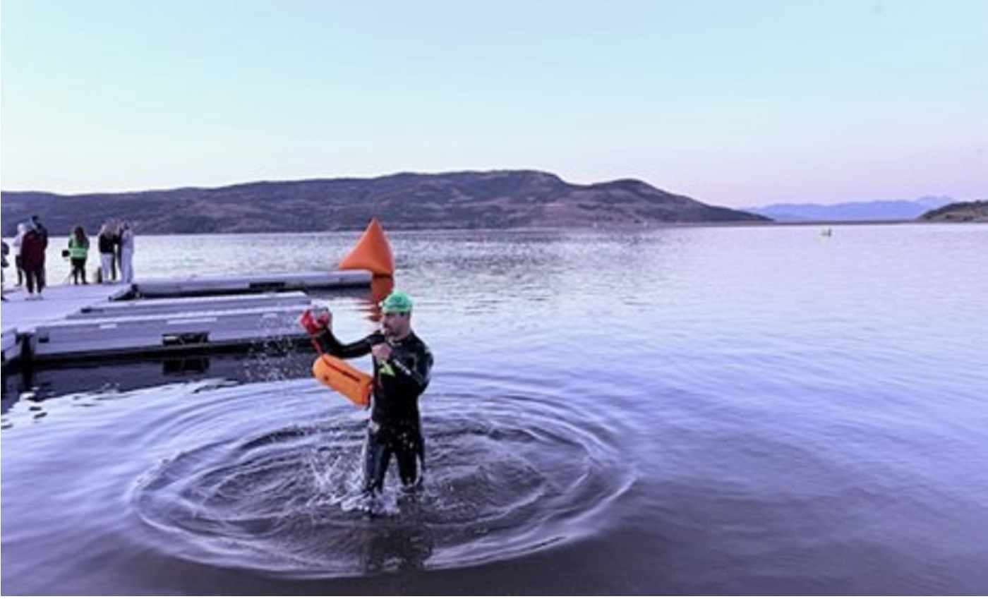 photo of a man climbing out of a resorvoir