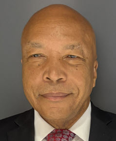 a man smiles for the camera