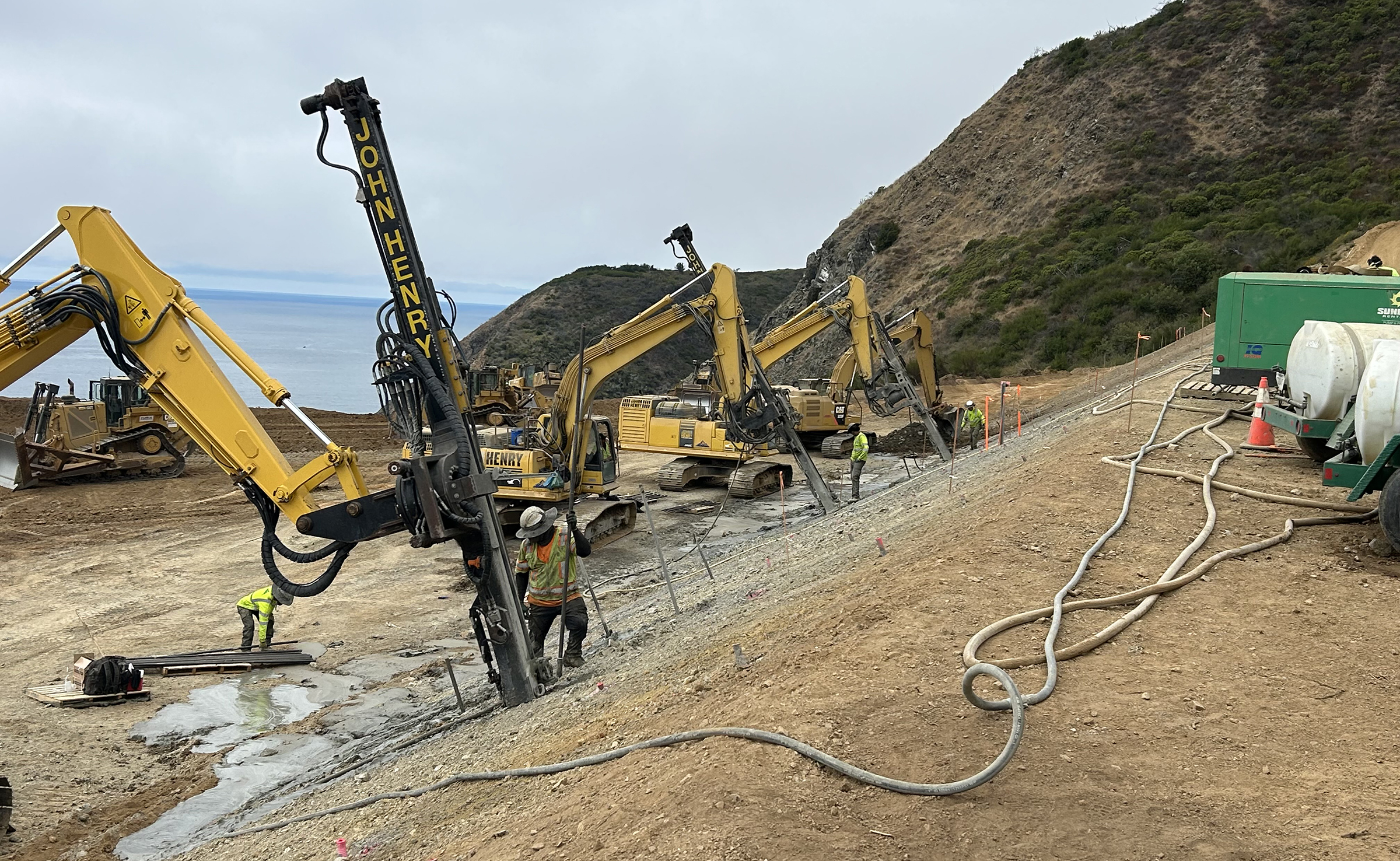 Drilling rigs working on steep slope during stabilization