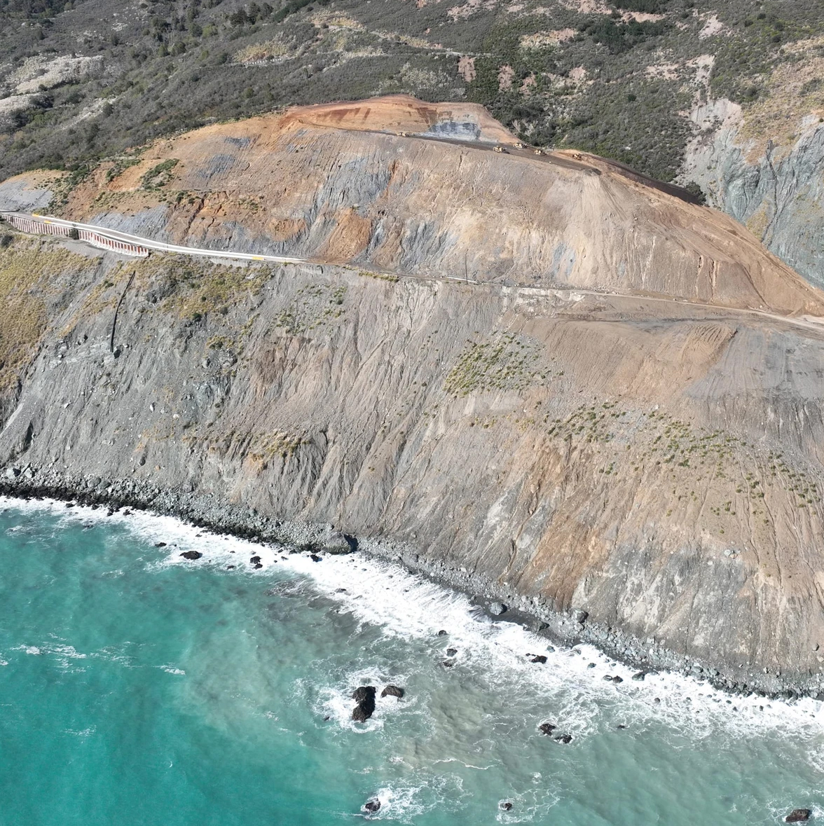 Aerial view of Highway 1 crossing a reconstructed landslide