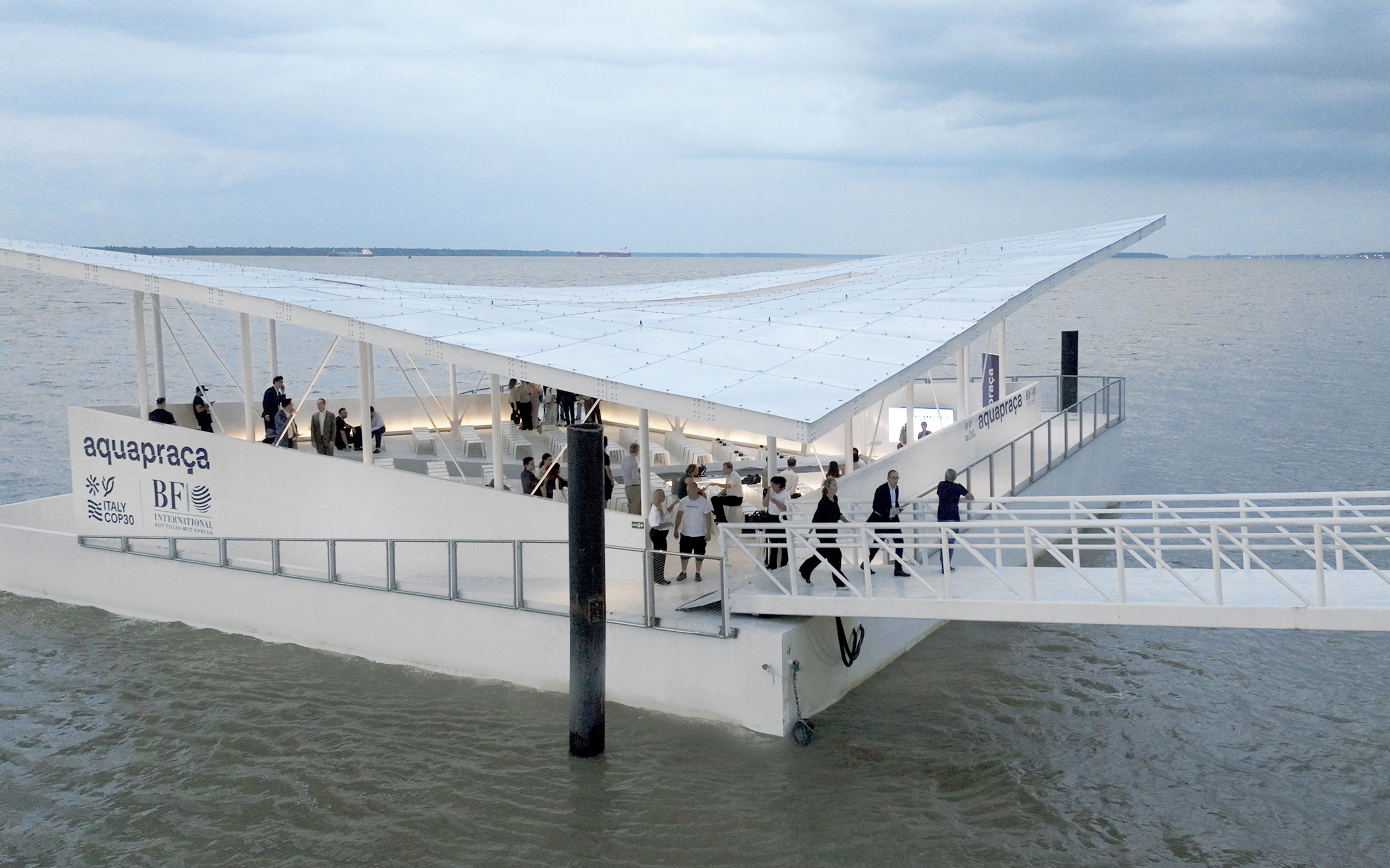 people stand on a floating structure