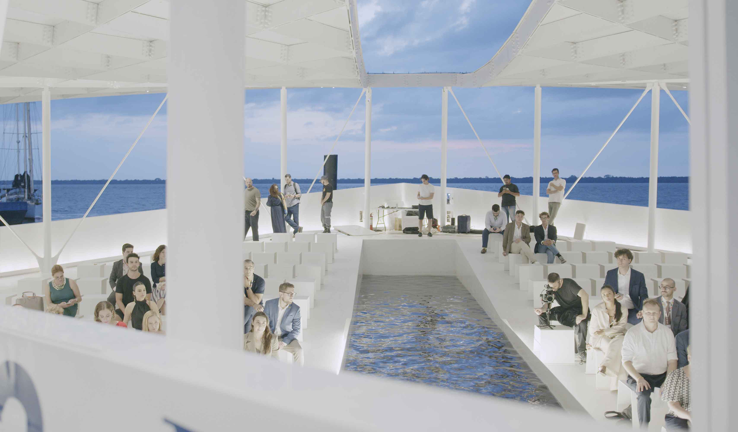 people sit on a floating structure