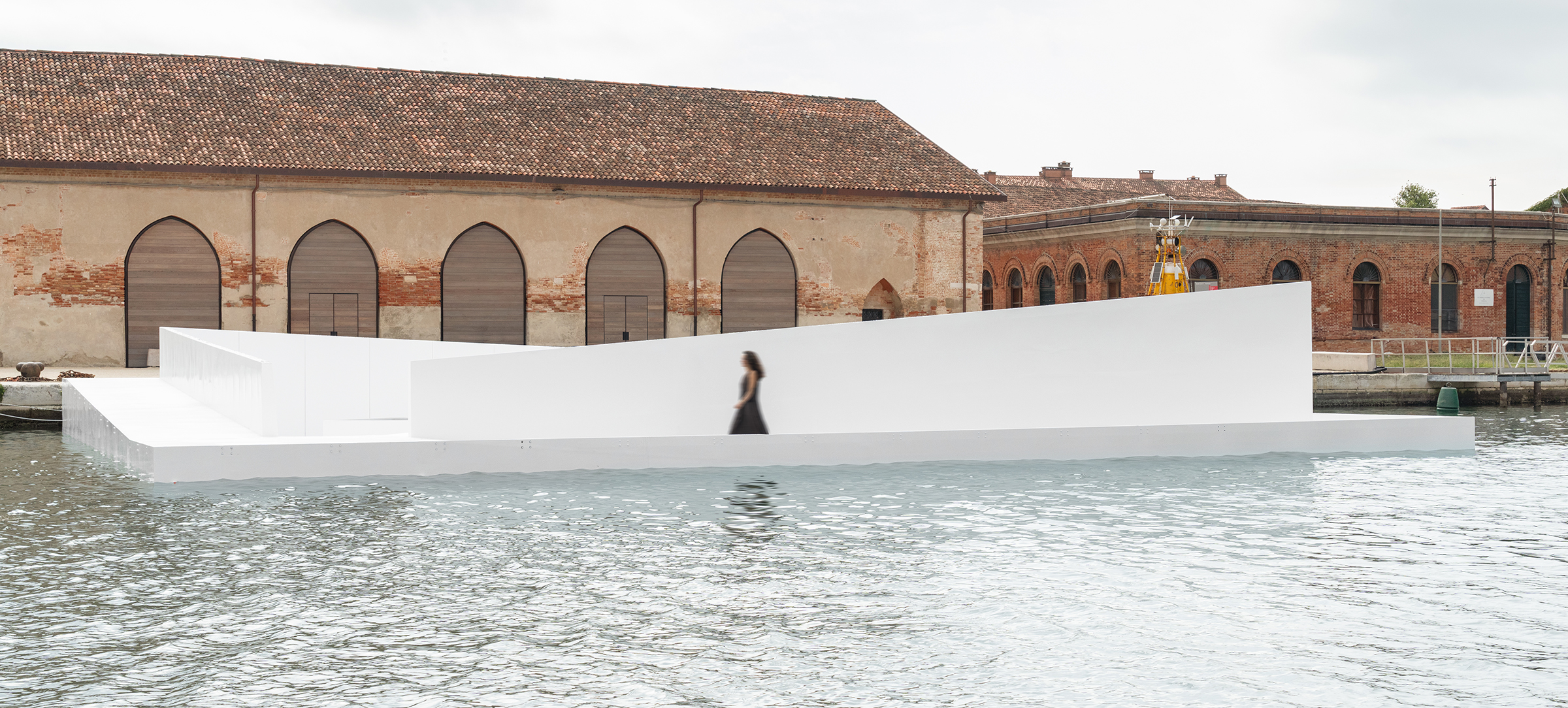 a person walks on a floatiny structure