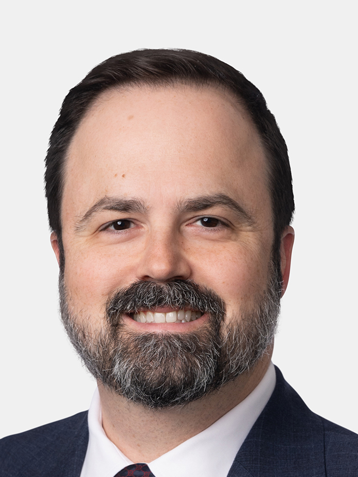 man smiles for the camera