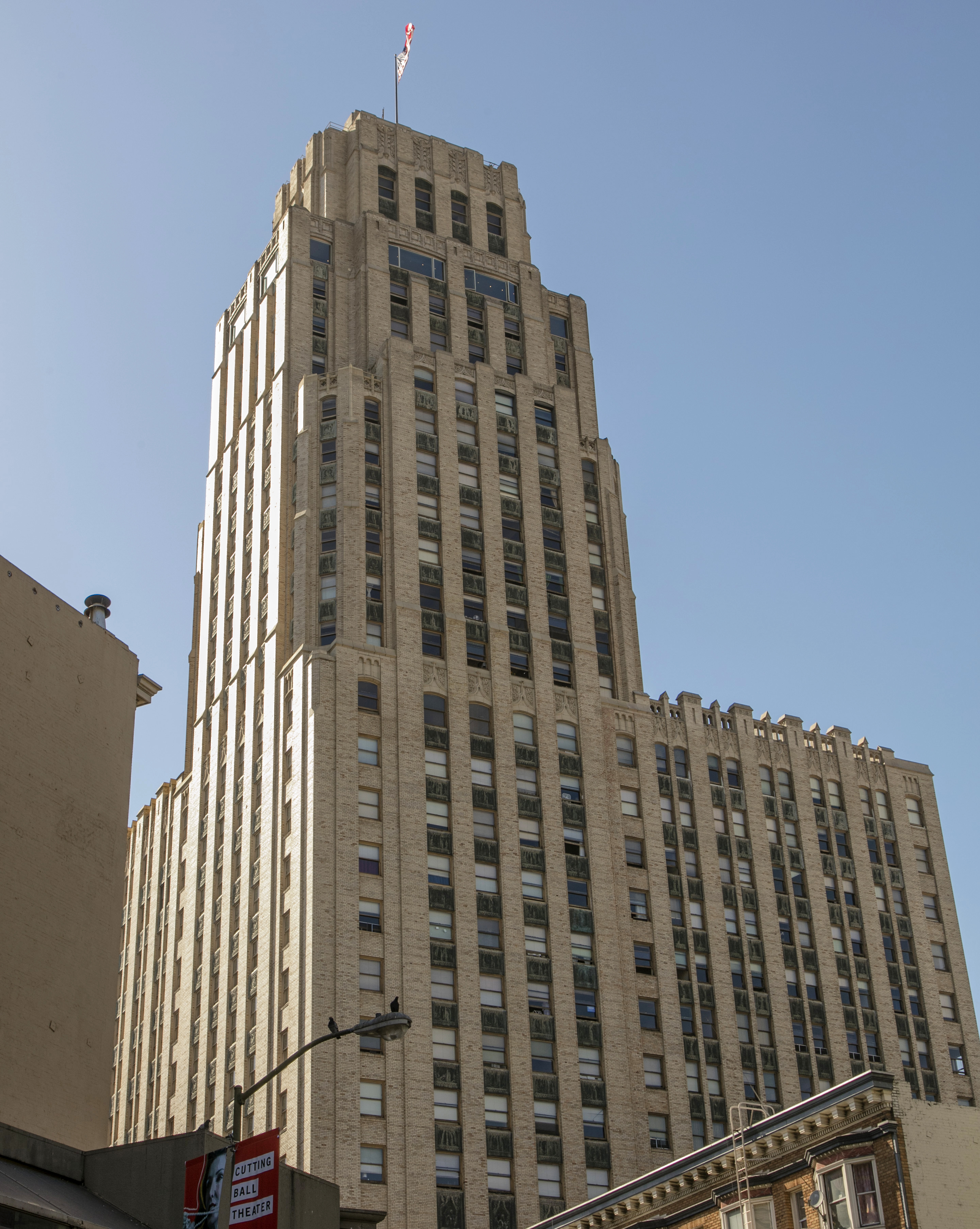 Tall office building seen from below on city street