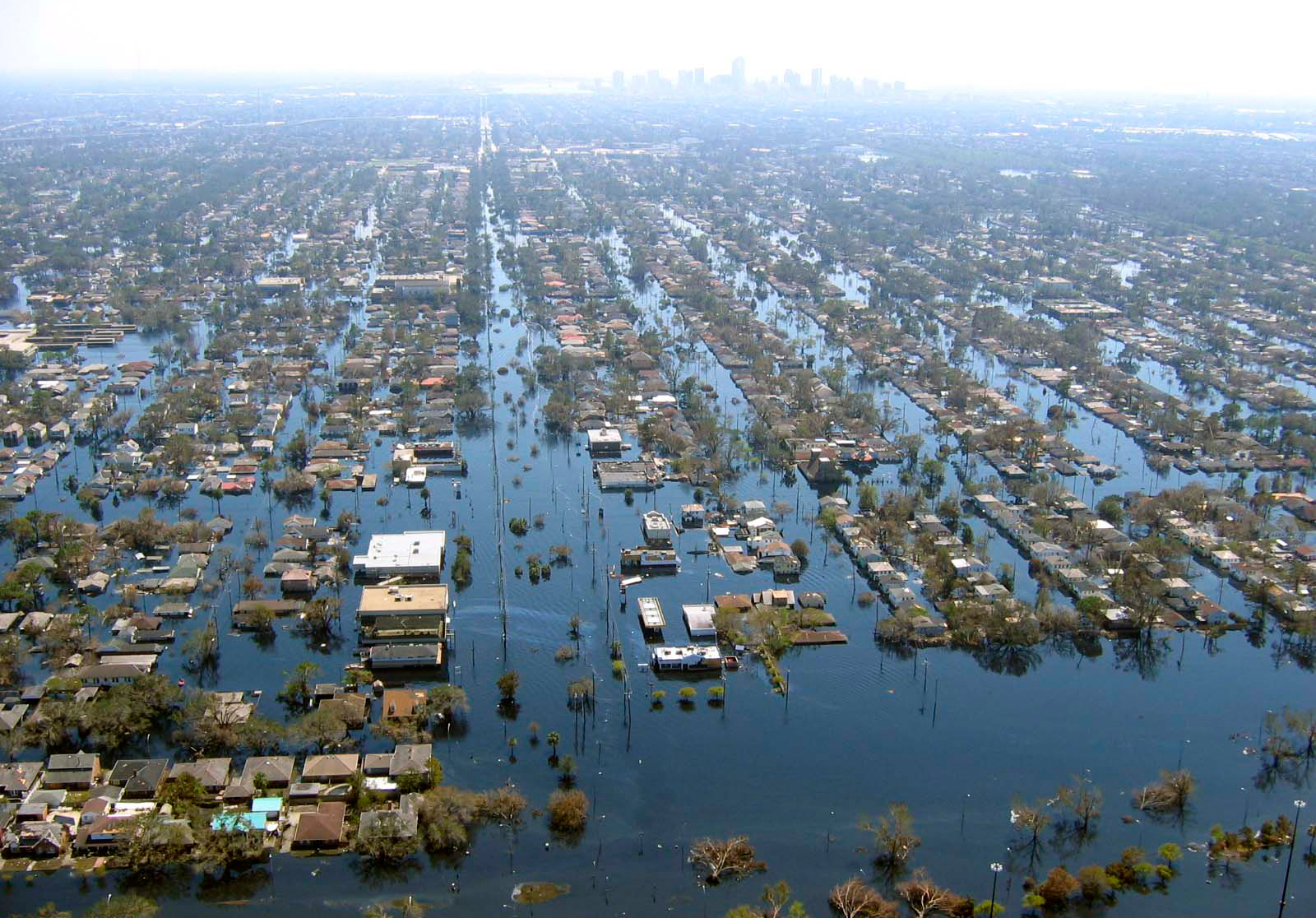 Aerial view of widespread neighborhood flooding with submerged streets and homes
