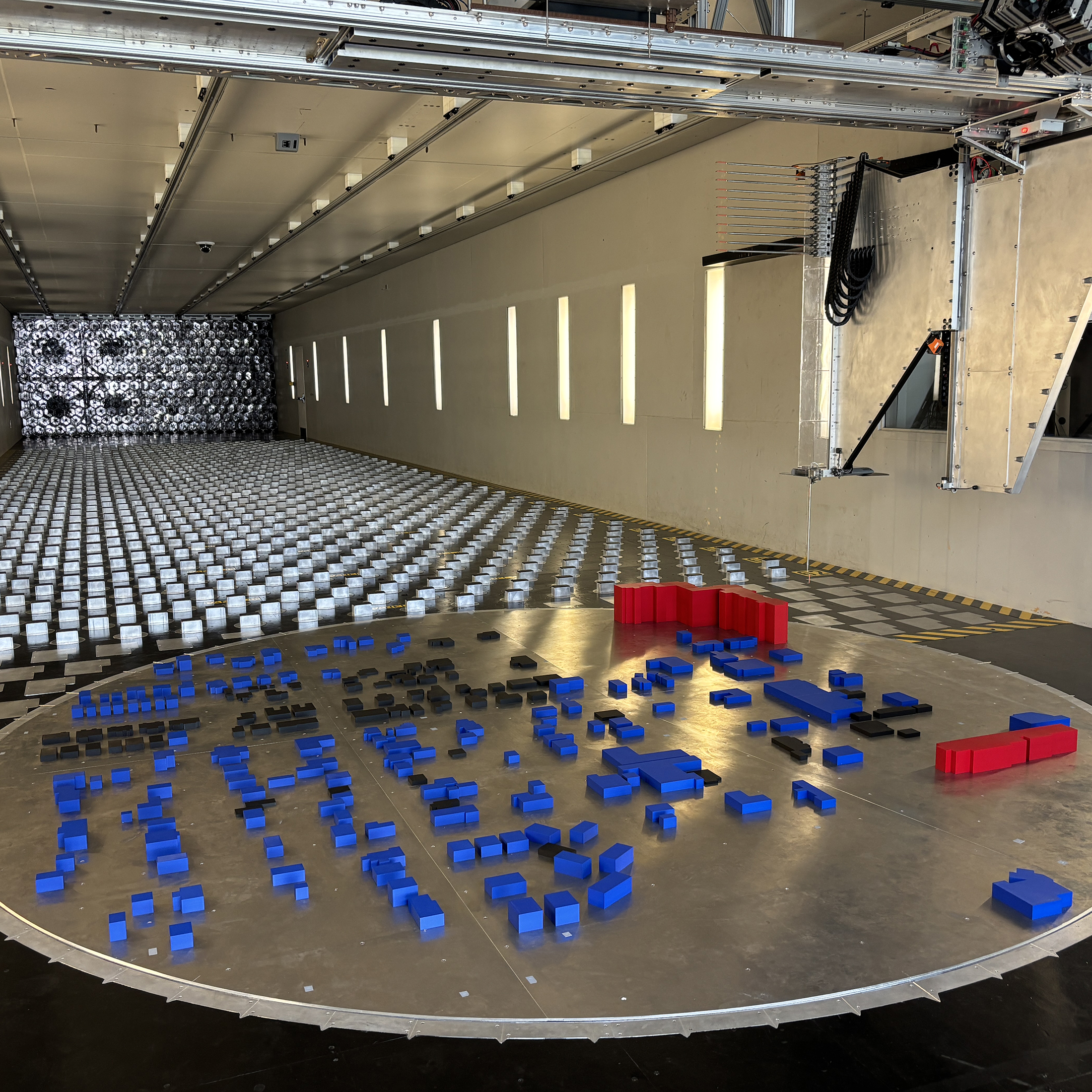 Wind tunnel test simulates hurricane winds using scaled neighborhood models and instrumentation