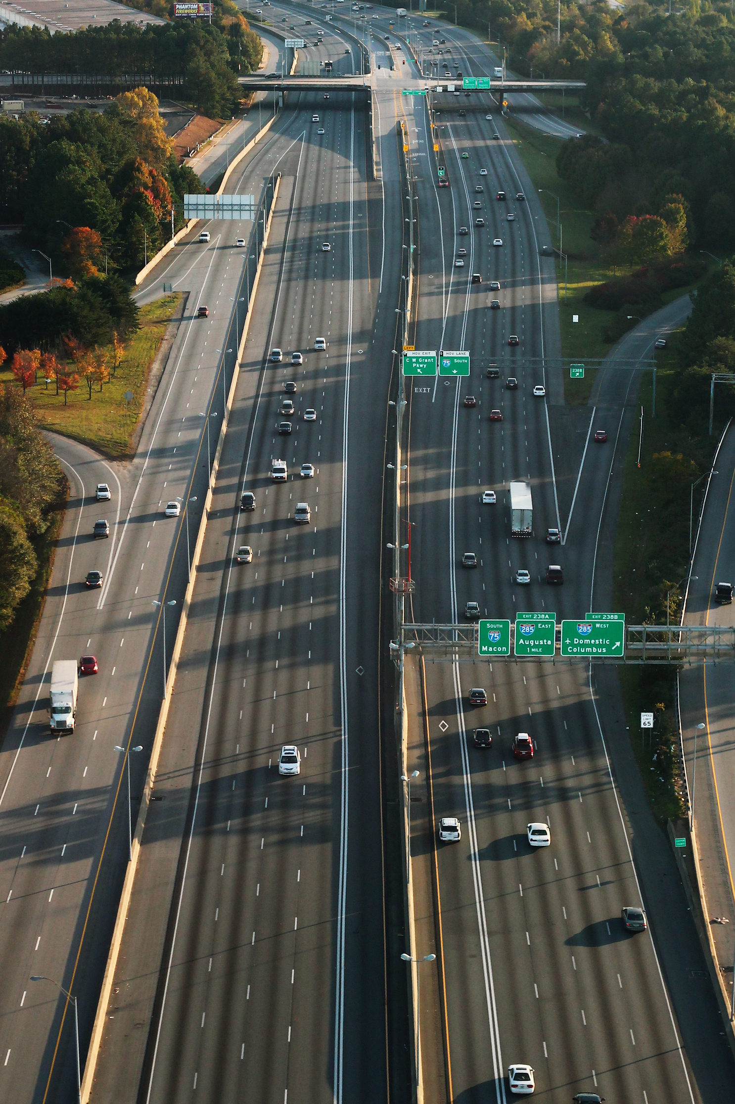 Multilane interstate highway with moderate traffic and overhead signs