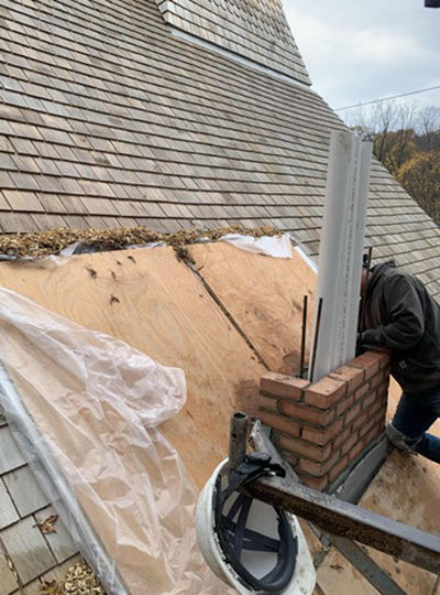 Restoration work integrates new materials into a historic building roof