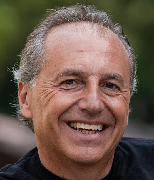 man smiles for the camera