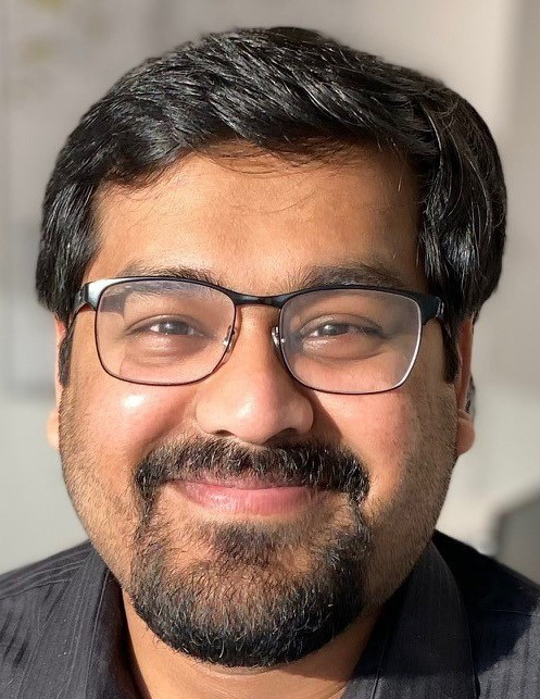 man smiles for the camera