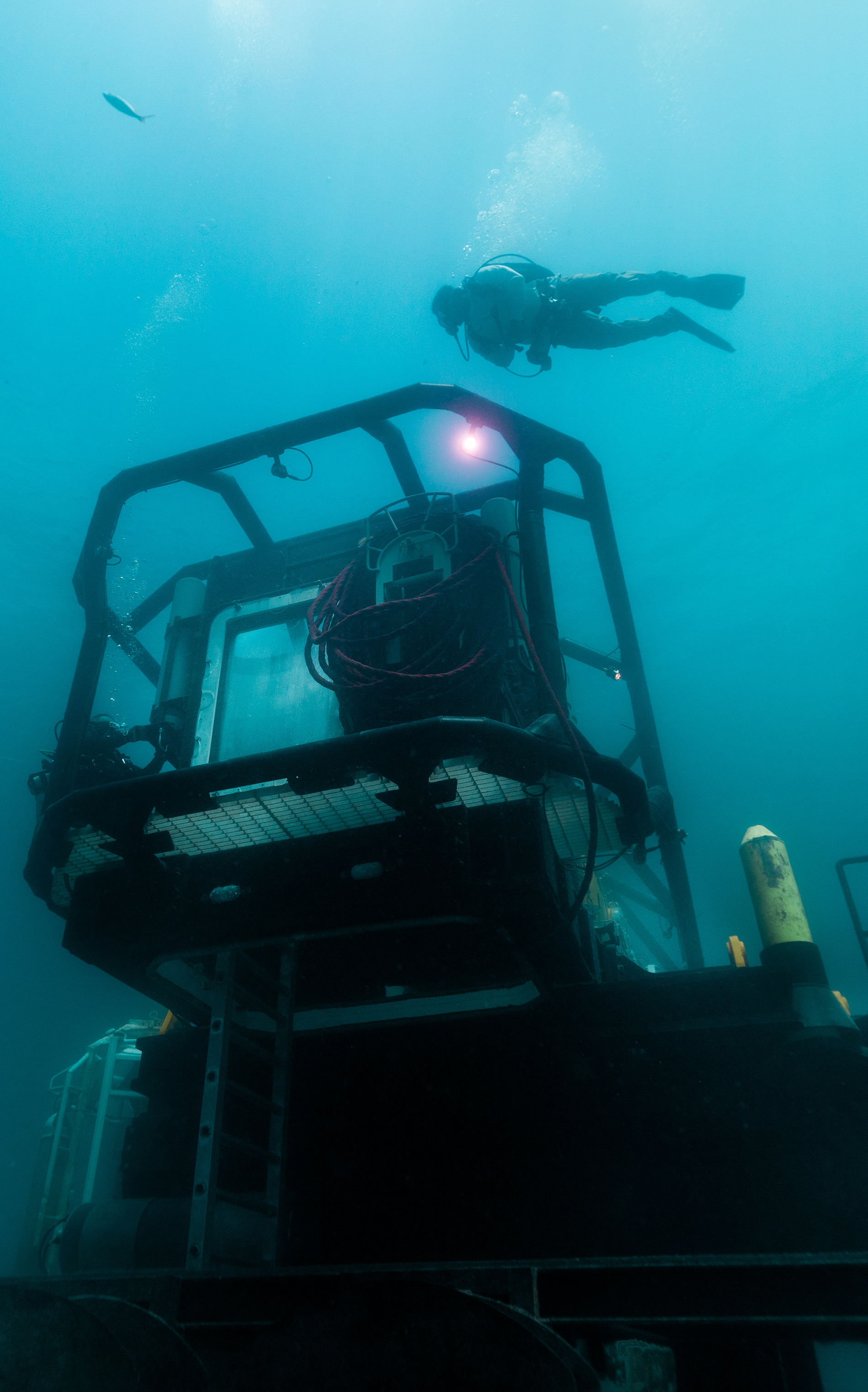 Diver swims above Vanguard habitat at Tennessee Reef