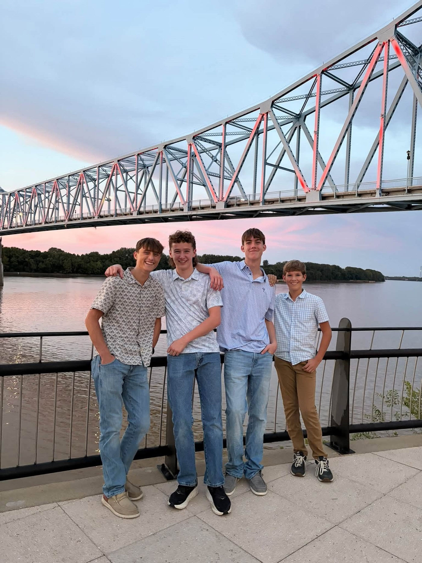 photo of the Blue Bridge Boys in front of the Blue Bridge
