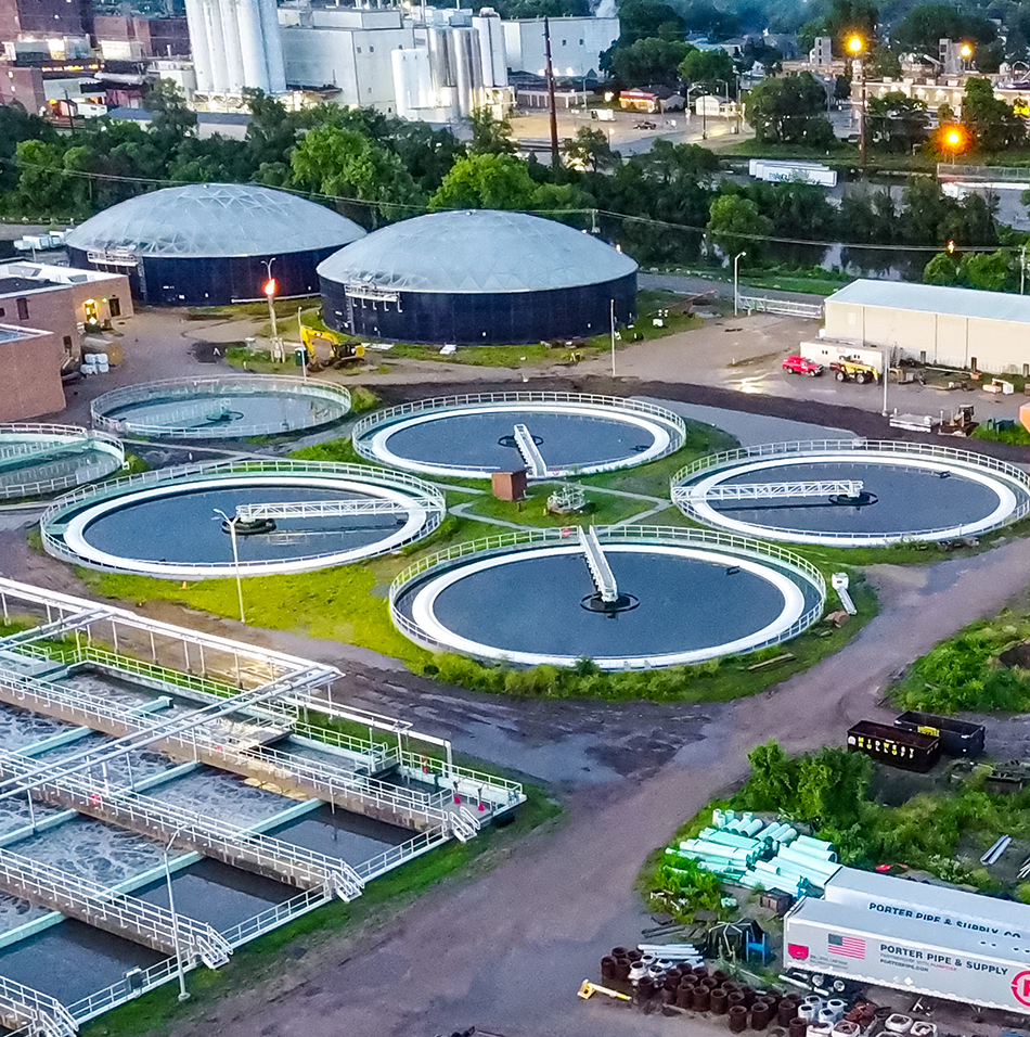 Water treatment facility with clarifiers, basins, and buildings