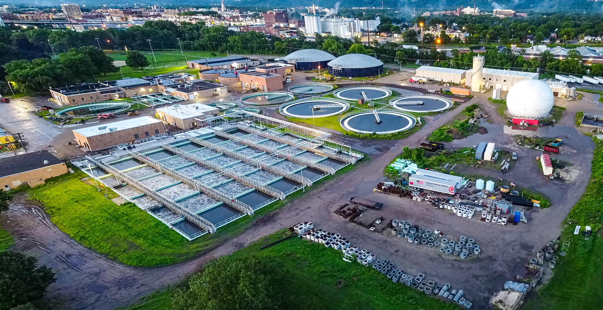Water treatment facility with clarifiers, basins, and buildings