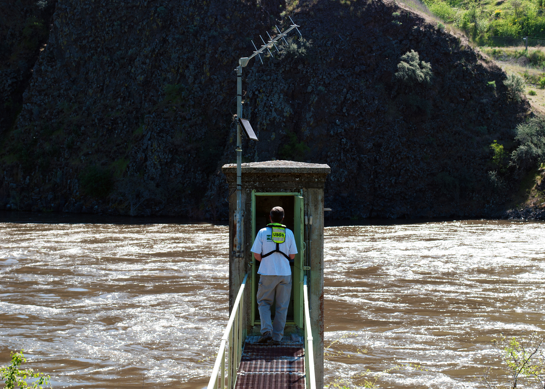 USGS streamgage station above river in rocky canyon