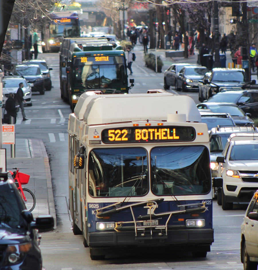 Bus service moves through a congested urban corridor