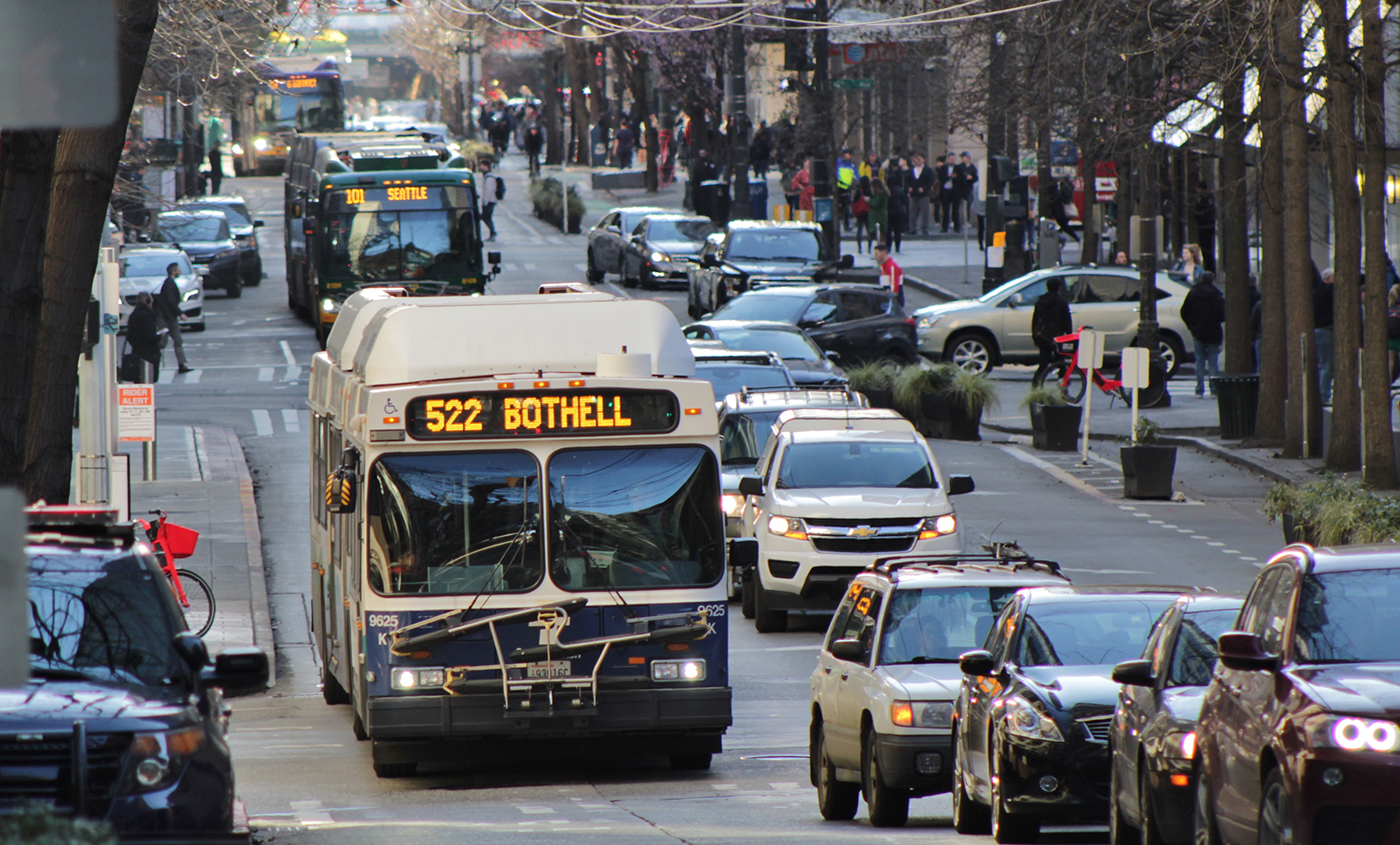 Bus service moves through a congested urban corridor