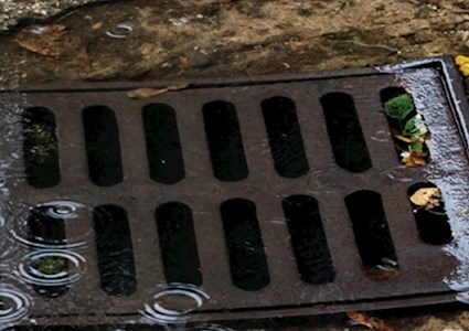 an overflowing storm drain